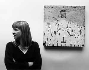Squeak Carnwath at her studio with her painting "What is Heard/What is Seen"